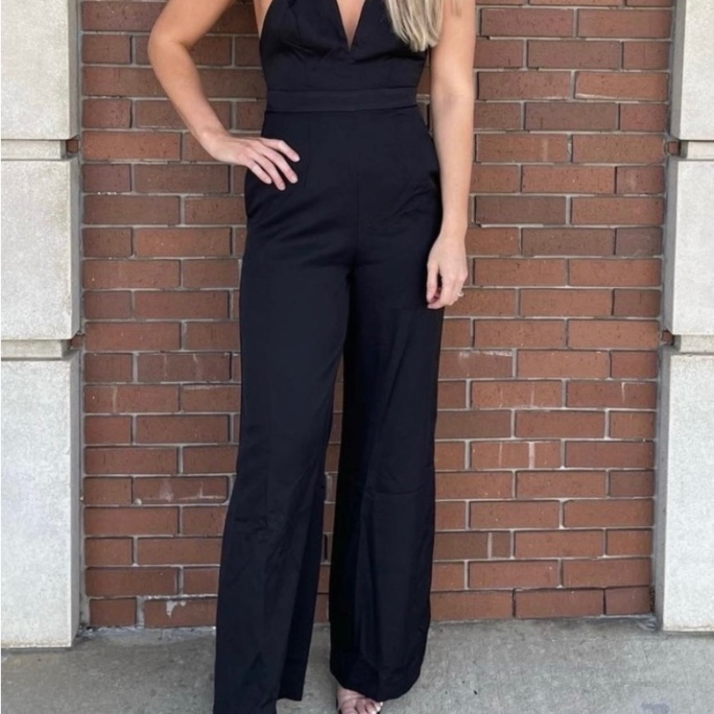 NWT. Beautiful black Hedi jumper. Slits at bottom.